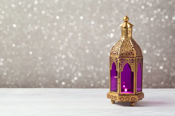 Lightened lantern on wooden table — Stock Photo, Image