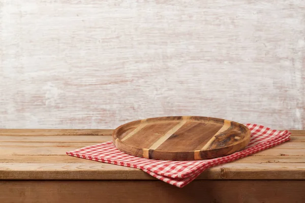 Wooden tray with checked tablecloth — Stock Photo, Image