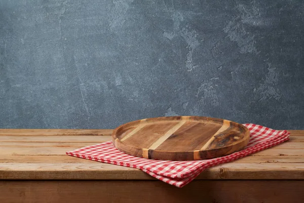 Wooden tray with checked tablecloth — Stock Photo, Image