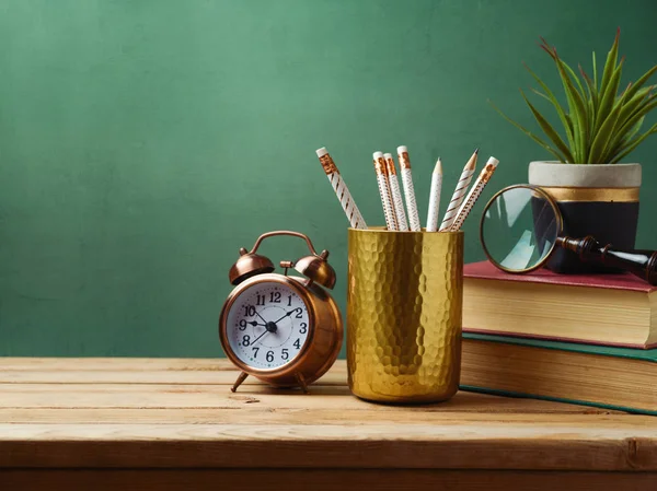 Pencils, alarm clock, books — Stock Photo, Image