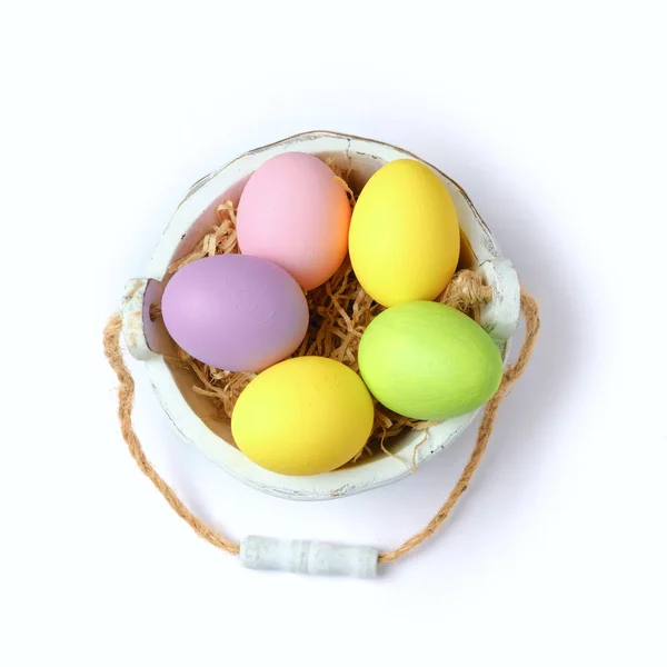 Easter eggs in wooden bucket — Stock Photo, Image
