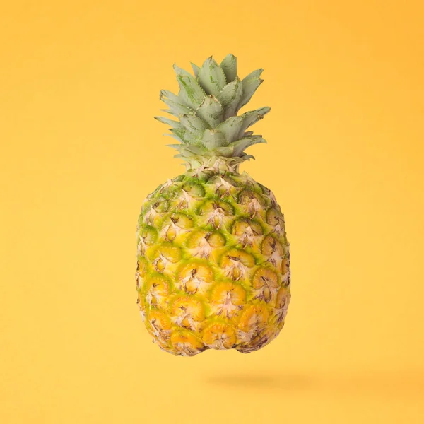 Pineapple over yellow background — Stock Photo, Image