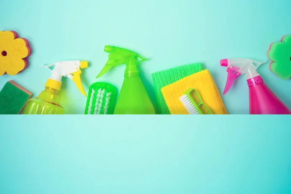Spring cleaning concept with supplies over blue baclground. Top — Stock Photo, Image