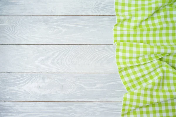 Green checked tablecloth on rustic wooden table. Kitchen, cookin — Stock Photo, Image