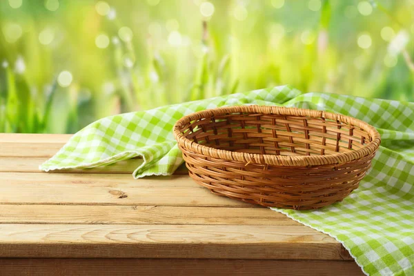 Empty Basket Tablecloth Wooden Table Green Bokeh Background Spring Easter — Stock Photo, Image