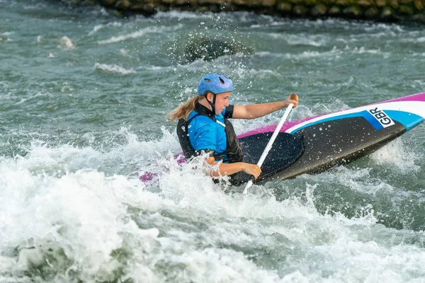 Great Britain Canoe Slalom athlete training on white water