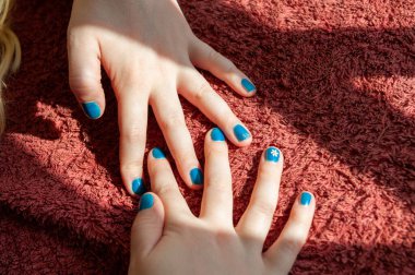 Vibrant blue painted fingernails clipart
