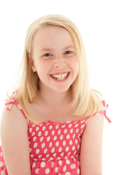 Close up of beautiful young blonde girl with a big smile wearing a pink and white polka dot dress. Isolated on white studio background — Stock Photo, Image