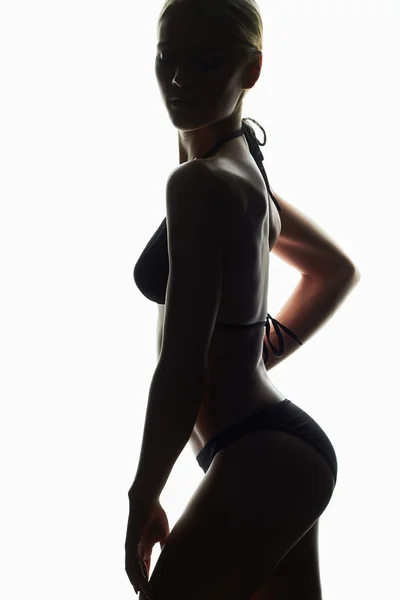 Silhouette.young kobiece kobieta w bikini.girl z ciała sportowe — Zdjęcie stockowe