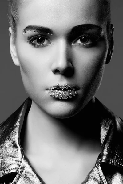 Fashion girl with crystals on lips wearing silver jacket — Stock Photo, Image