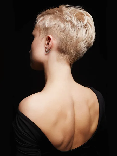 Beautiful back of young woman in a black sexy dress — Stock Photo, Image