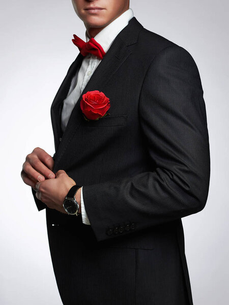 man with flower.groom man in suit