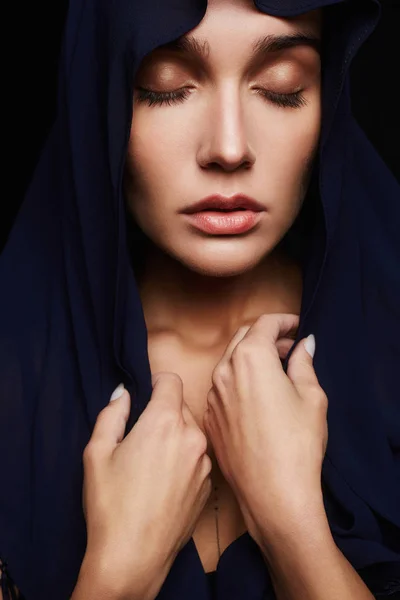 Religious young woman in hood — Stock Photo, Image