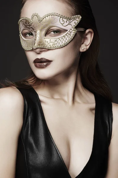 Beautiful young woman in mask — Stock Photo, Image