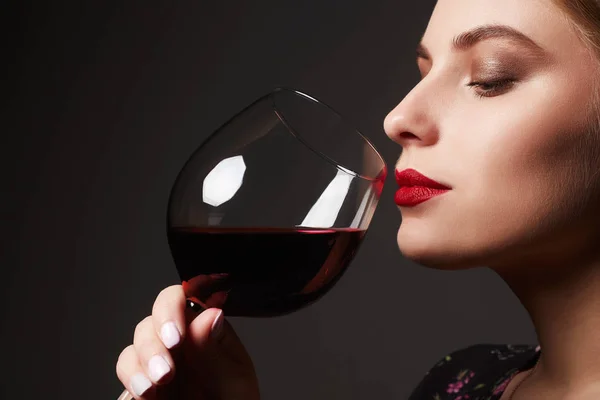 Beautiful young woman with wine