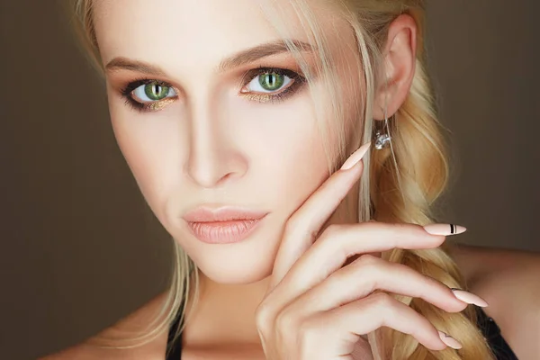 Young woman with make-up and manicure nails — Stock Photo, Image