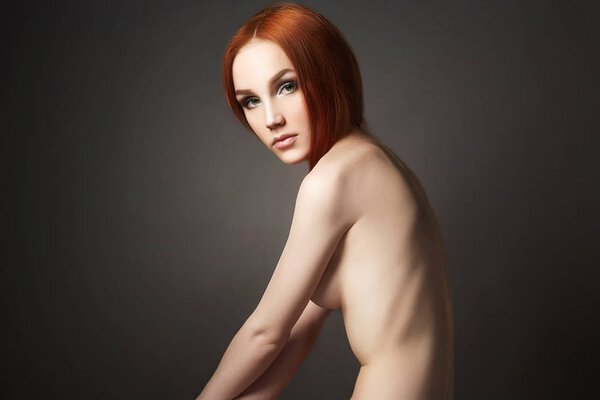 Nude sexy Beautiful young woman back. red hair model. beauty naked ginger girl