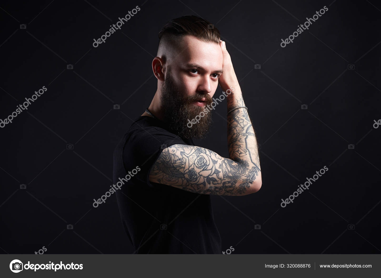 man with beard. Boy with stylish haircut and tattoo Stock Photo | Adobe  Stock