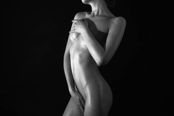 Nude Young Woman silhouette in the dark. Beautiful Sexy Naked Body Girl