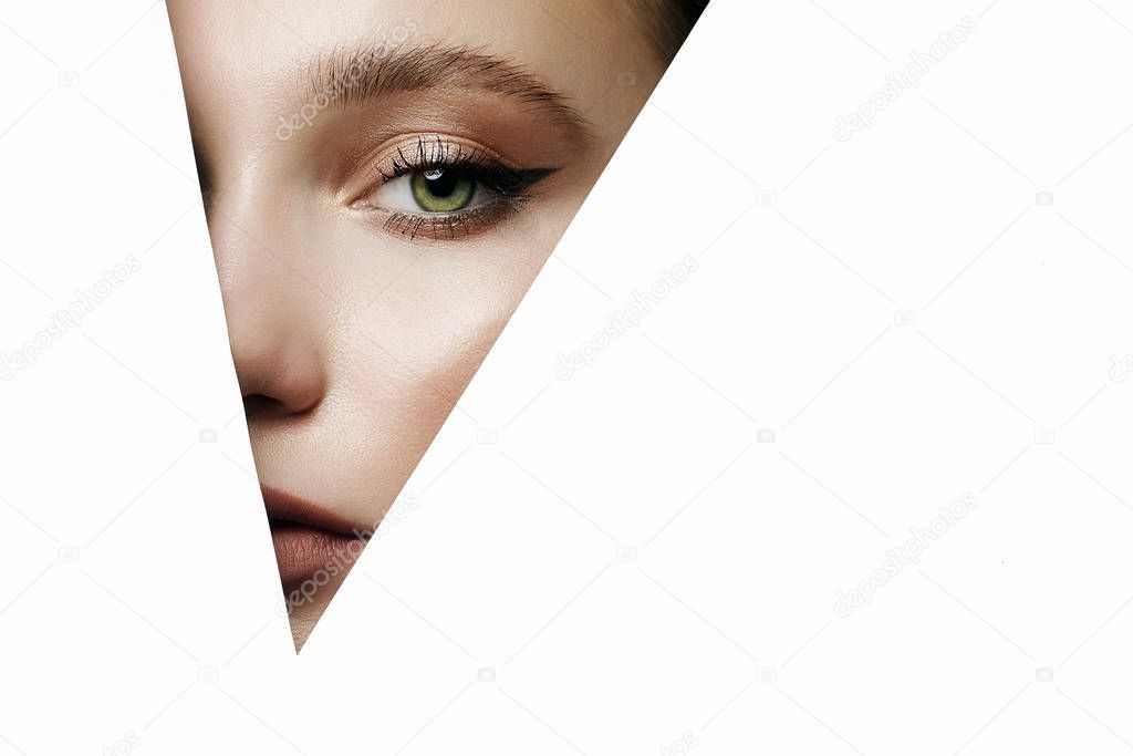 young beautiful woman in white triangle. make-up