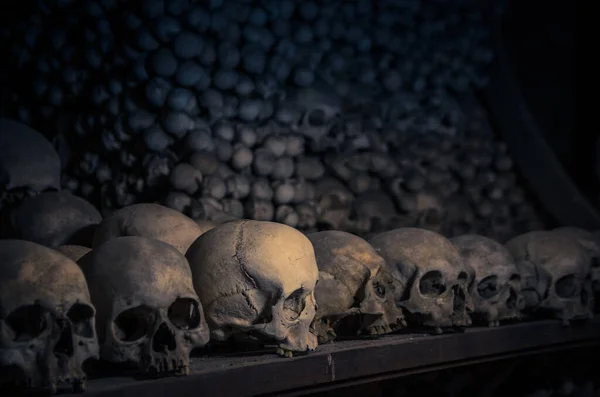 Human bones and skulls. Pile of skulls. Skulls collection. Symbol of death, fear and evil. Kostnice Church in Kutna Hora.