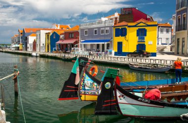 Aveiro, Portugal - June 13, 2017: Moliceiro tradtional boat gondola clipart