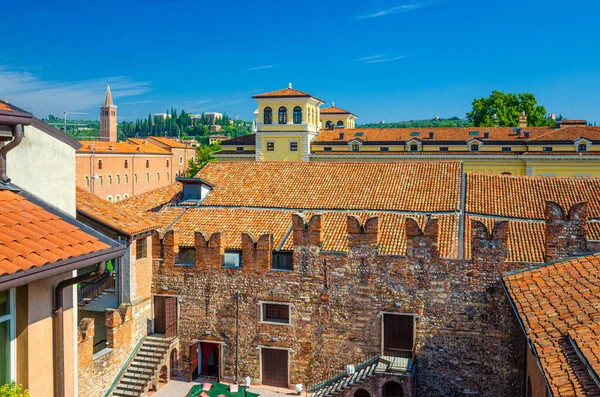 stock image Teatro Nuovo theatre courtyard, brick wall with merlons and red tiled roof