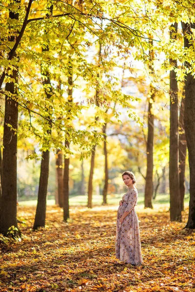 Pregnant female in autumn — Stock Photo, Image