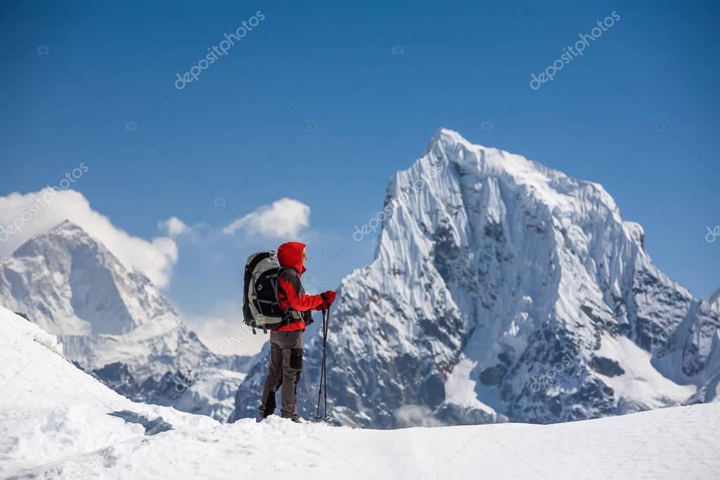 Trekker is walking by Renjo La pass in Everest region