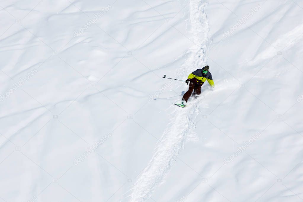 Snowboarder on the way down in winter mountains, Gudauri, Georgi