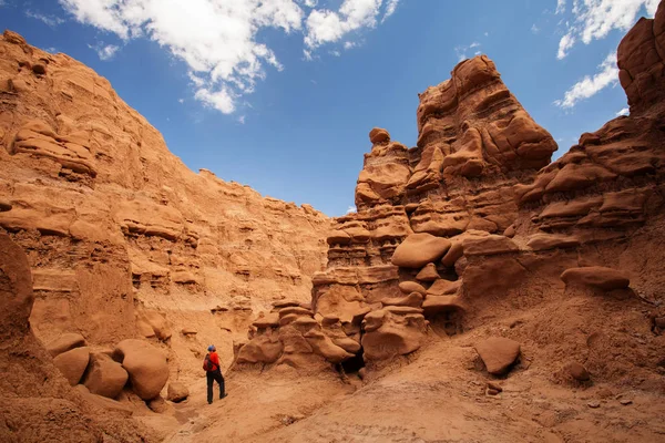 Hiker visit Goblin valley state park in Utah, USA