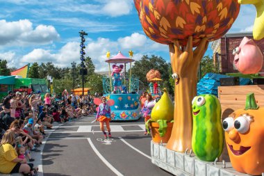 Orlando, Florida. November 06, 2019. Abby Cadabby and colorful float in Sesame Street Party Parade at Seaworld 1 clipart
