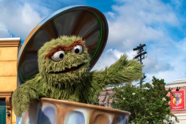 Orlando, Florida. November 06, 2019. Oscar the Grouch in Sesame Street Party Parade at Seaworld 4 clipart