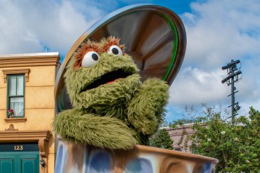 Orlando, Florida. November 06, 2019. Oscar the Grouch in Sesame Street Party Parade at Seaworld 5. clipart