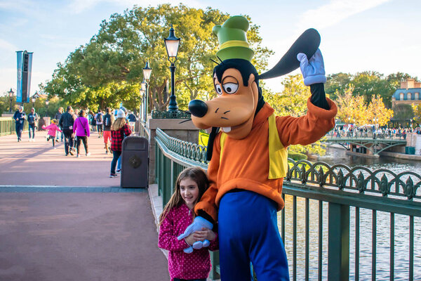 Orlando, Florida. December 18, 2019. Goofy with little girl at Epcot (57).