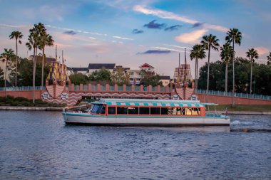 Orlando, Florida. December 18, 2019. Colorful bridge and taxi boat in Lake Buena Vista area (49).