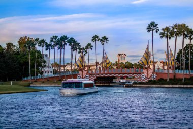 Orlando, Florida. December 18, 2019. Colorful bridge and taxi boat in Lake Buena Vista area (48).