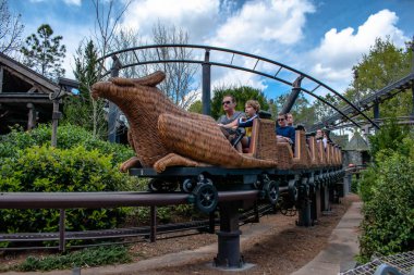 Orlando, Florida. March 02, 2019. People having fun Flight of the Hippogriff roller coaster at Universals Islands of Adventure (144). clipart