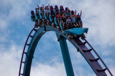 Orlando, Florida. February 15, 2020. People having fun terrific Mako rollercoaster at Seaworld (39) clipart