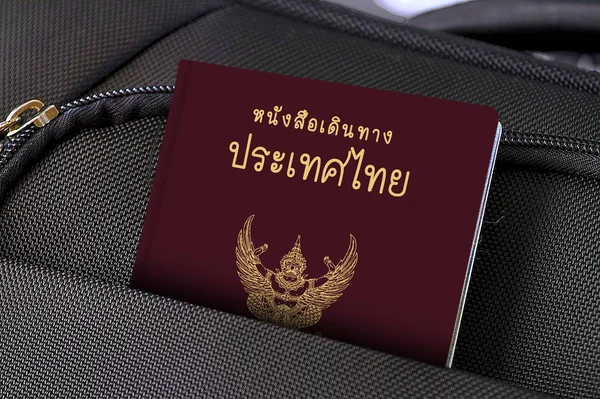 Паспорт в чёрном кармане в Таиланде — стоковое фото
