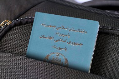 Close up of Afghanistan Passport in Black Suitcase Pocket  clipart