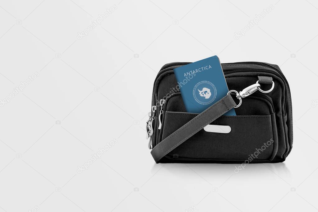 Antarctica Passport in Black Travel Bag Pocket with Copy Space on Isolated Background