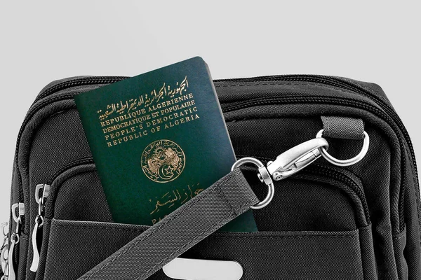 Close up of Algeria Passport in Black Travel Bag Pocket