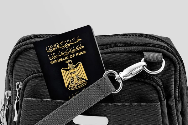 Close up of Iraq Passport in Black Travel Bag Pocket