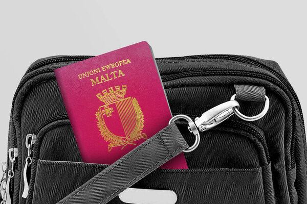 Close up of Malta Passport in Black Travel Bag Pocket