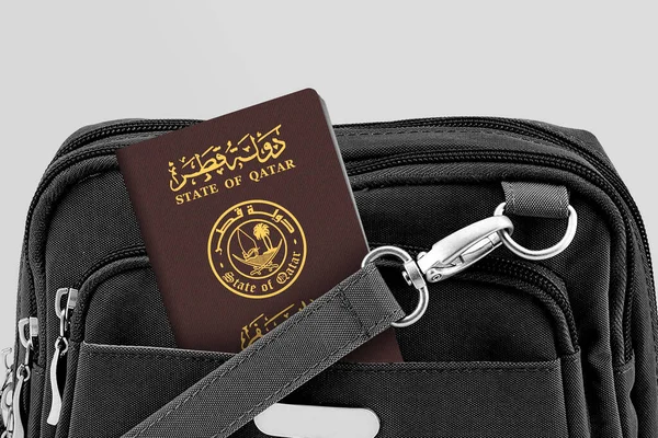 Close up of Qatar Passport in Black Travel Bag Pocket