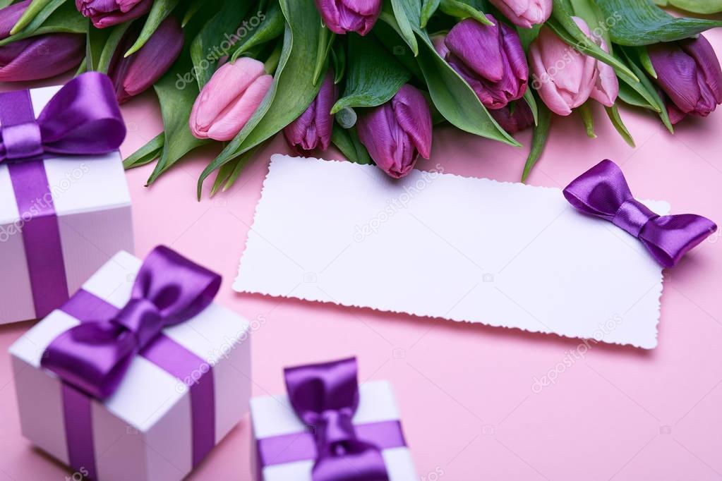 Flowers and gifts on pink