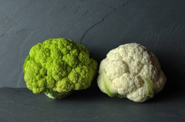 white and green cauliflower on gray background