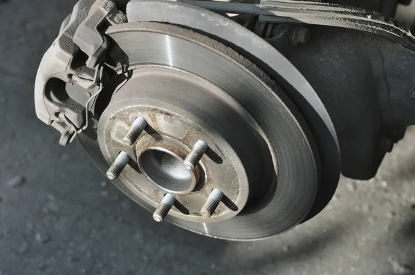 Car brake disc with brake caliper when the wheel is removed