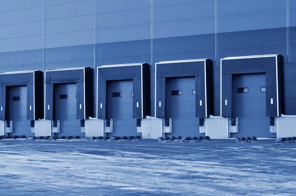 Front view of loading docks of a modern logistics center. classic blue color — Stock Photo, Image